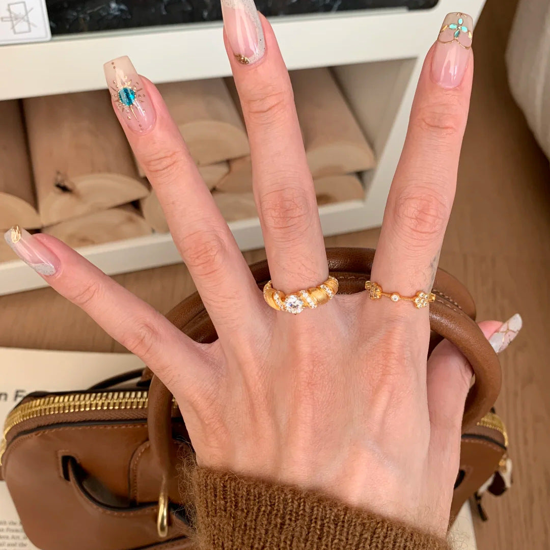 Vintage brushed Möbius horn-shaped diamond ring